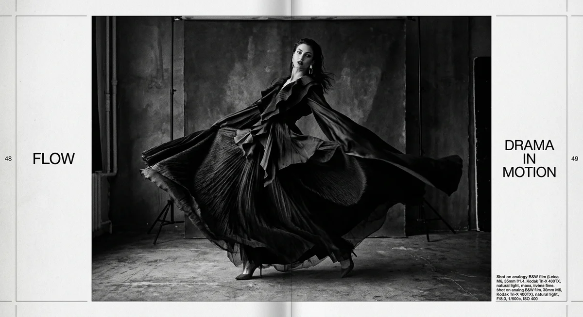 Editorial fashion spread of a model in a billowing ruffled gown caught mid-motion in an industrial studio